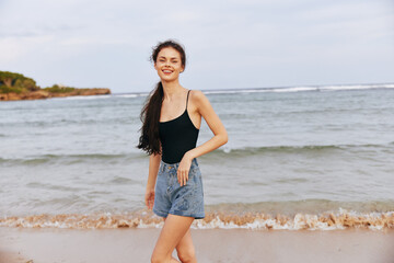 Fototapeta na wymiar woman sea vacation sunset enjoyment beach summer smile lifestyle sand ocean
