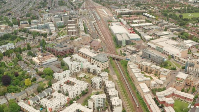 Aerial shot over train arriving at Cambridge station