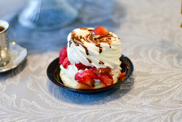 Homemade vanilla chocolate coffe mocha cake with a pastel tone and strawberry