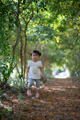 portrait of a little girl in flower garden