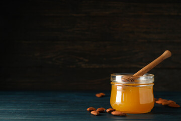 Concept of tasty and sweet food - honey with nuts