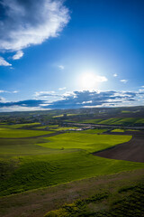Cloudy azure wonderful skies and lush fields and plains