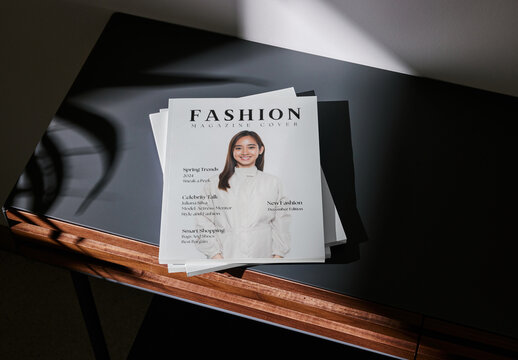 Mockup of closed US letter size magazines with customizable covers on small table