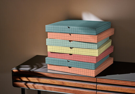 Mockup of stack of customizable closed cardboard pizza boxes on small table