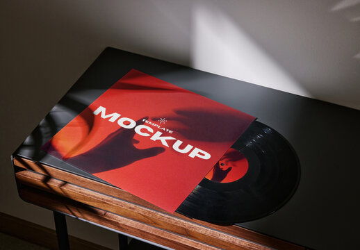 Mockup of customizable LP vinyl record album sleeve and label on small table