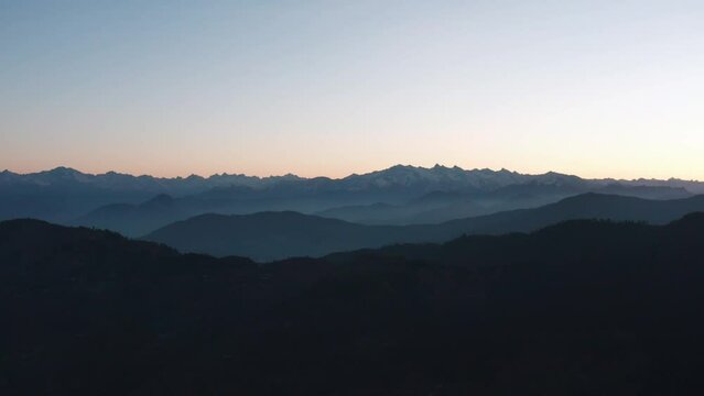Silhouettes Of Mountain Ranges During Sunrise In Sangla Valley, Himachal Pradesh India. Aerial Wide Shot