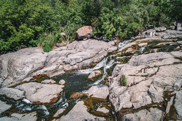 Waterfall on the river Ingulets in Krivoy Rog, Ukraine.
A unique miracle of nature, water flows over stones at the Karachunovsky reservoir
