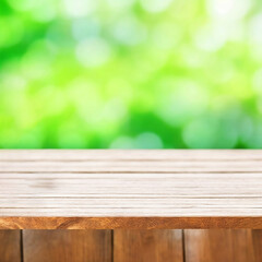 Wooden table with green background