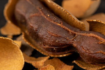 open ripe tamarind pods with edible pulp