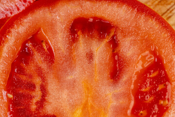 pieces of red ripe tomato close up
