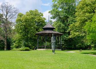 Wooden gazebo and Statue of the poet Vladimir Nazor at Tuskanac Park, Zagreb, Croatia