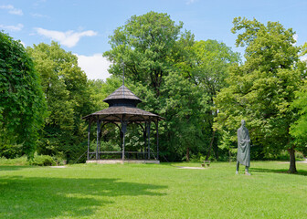 Wooden gazebo and Statue of the poet Vladimir Nazor at Tuskanac Park, Zagreb, Croatia