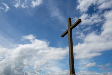 Bray Head cross against a blue sky with white clouds