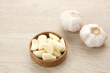 Fresh garlic (bawang putih) on a wooden table
