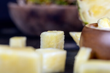 milk pineapple yogurt with pieces of pineapple and other fruits