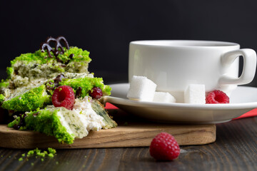 A piece of sweet green cake with berries