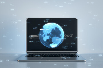 Close up of laptop computer with creative glowing blue map or globe hologram on blurry workplace background. Earth, metaverse and technology concept. 3D Rendering.