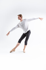 Full Length portrait of Caucasian Young, Handsome, Sporty Athletic Ballet Dancer with Lifted Hands on White.