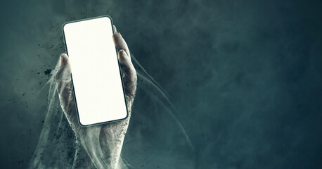 Zombie hand holding a smartphone