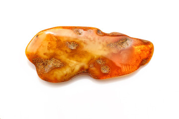 Matte landscape amber  with inclusion a white background. Sun stone. Fossil fossilized resin. semi-precious mineral. Natural material for jewelry. Copal. Science and geology. Insects in amber stone.  