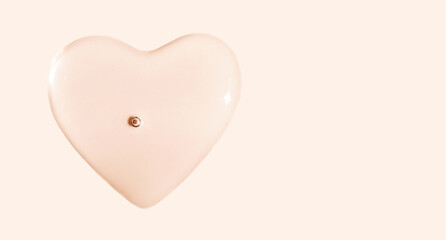 round drops of transparent gel serum on beige background