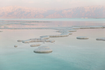 Salt formations in dead sea at sunset