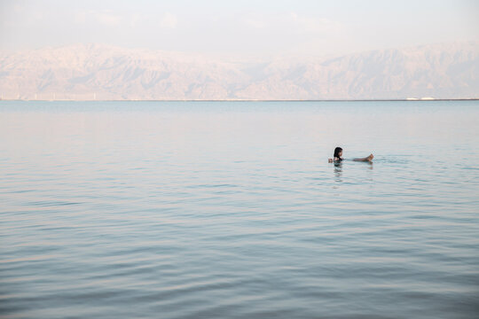 Young woman swimming in dead sea, Israel