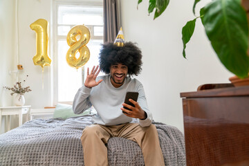 Happy man doing video call celebrating birthday at home