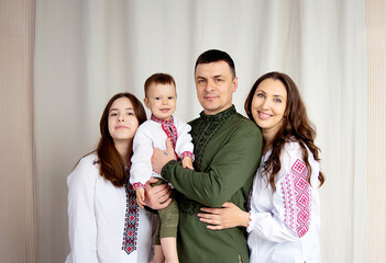 Happy family in Ukrainian national clothes