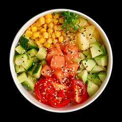 Hawaiian salmon poke bowl with seaweed, avocado, sesame seeds and cucumber on black background. Top view, flat lay