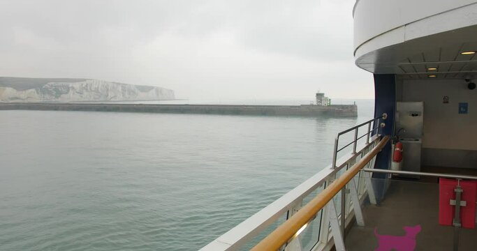 White Cliffs Of Dover Seen In Distance From Ferry Deck Cruising Across English Channel In The UK. wide, POV