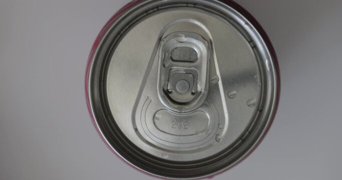Closeup of open aluminum can of soda. Aluminum pull tab