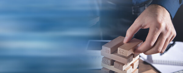  Man stacking a wooden blocks. Business. Plan. Strategy