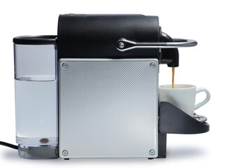 Home semi professional automatic coffee capsule metal machine side view pouring coffee into a cup for making coffee drinks on the bar at home isolated clipping path on white background with shadow.