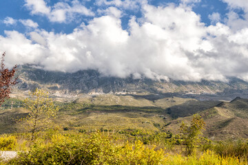 Beautiful mountain valley with gentle hills and clouds