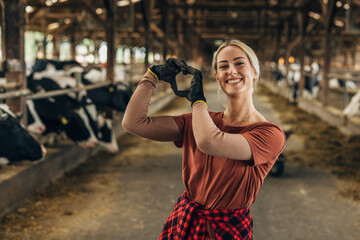 A young Caucasian woman loving farm life.