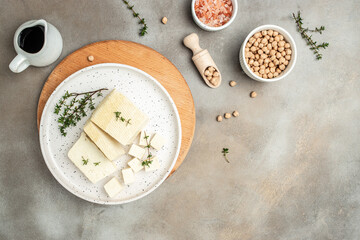 tofu cheese cubes on a light background. banner, menu, recipe place for text, top view