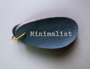 Blue leather with text written MINIMALIST, means person who focus on what really matters,...