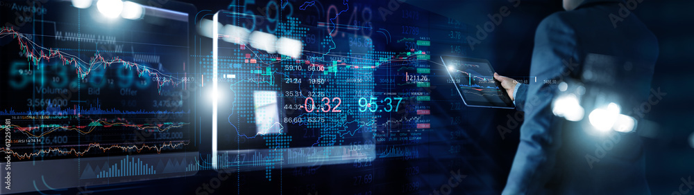 Aufkleber Businessman using tablet for analyzing data stock market in monitoring room with data in the chart on screen, Stock traders, Graph chart and trading, Investment of Financial and stock market.
