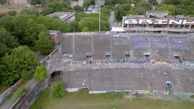 Abandoned Alonzo Herndon Stadium in Atlanta, Georgia with drone video moving left to right.