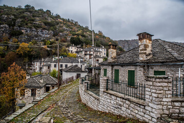 Fototapeta na wymiar Kapesovo village, a small but graphical village in zagorochoria on a beautiful winter rainy day, Ioannina, Epirus, Greece