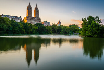 Fototapeta na wymiar The Lake in the Central Park in New York City with the reflection of The San Remo apartment building in dusk. 