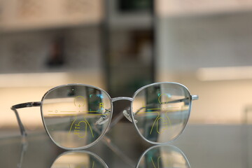 Eyeglasses progressive lens on table, glasses on the table