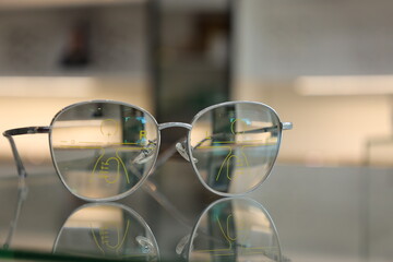glasses on the table, eyeglass progressive lens on table in clinic 