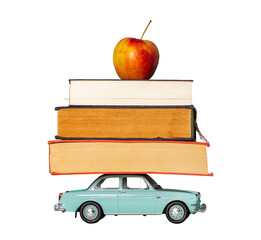 Books with apple on toy car roof, back to school. Isolated on transparent white background