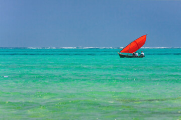 Red sail in the ocean. Zanzibar. Tanzania