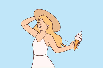Girl with ice cream in waffle cone enjoys summer holidays and hot sunny weather.