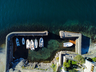 Fototapeta na wymiar Aerial view of the harbor of Corenno Plinio