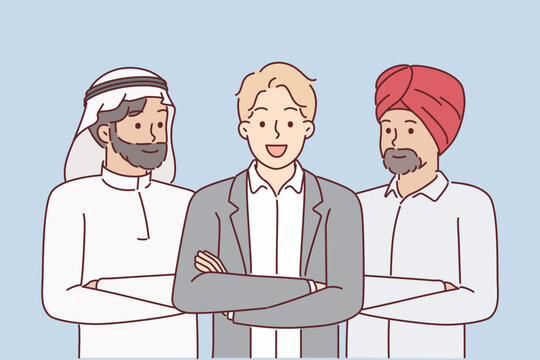 Multinational business team of people from different cultures in national Arabic and Indian clothes