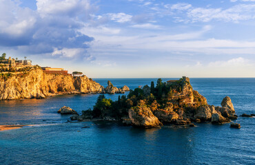 Fototapeta premium travel landscape of beautiful isle among blue sea waves and colorful cloudy sky on background